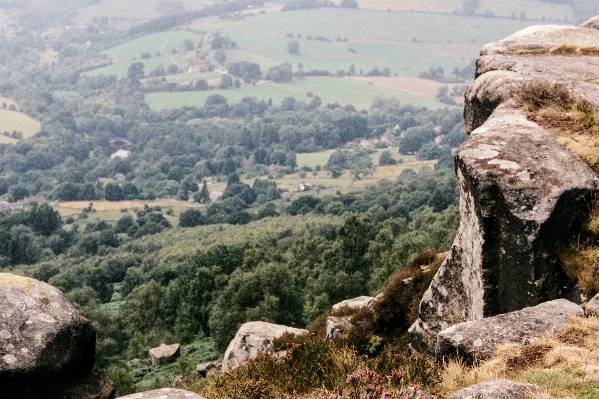 Peak District chauffeur tour: gritstone edge above a wooded valley